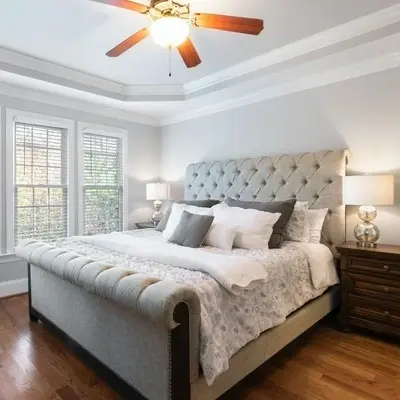 Large, light bedroom, with bed