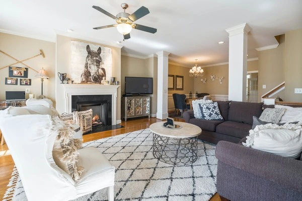 Designed Living Room, with Fireplace, Table, and Couch